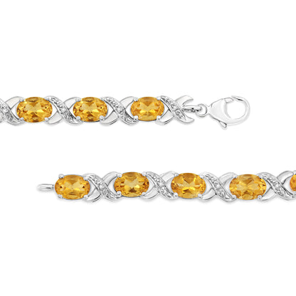 .925 Sterling Silver 7x5 mm Oval Cut Orange Citrine and 1/20 cttw Round Cut Diamond Fashion Tennis Bracelet (I-J Color, I1-I2 Clarity) - 7"